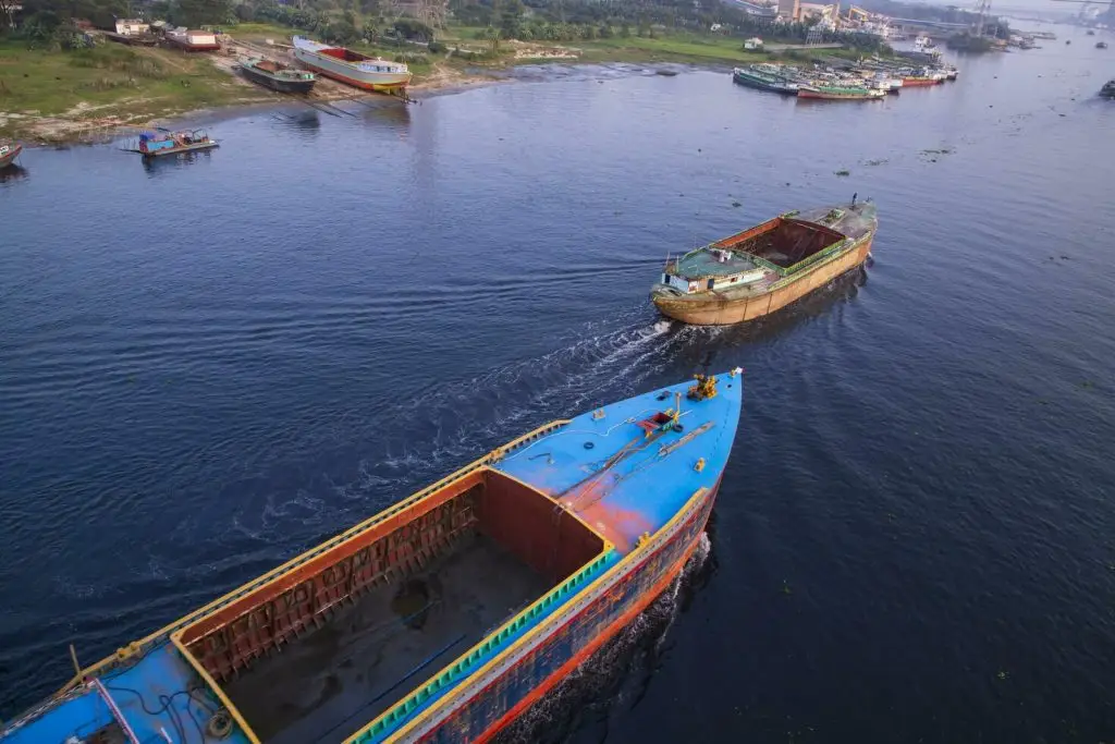 aerial view landscape of sand bulkheads ships with industrial zone in sitalakhya river narayanganj bangladesh free photo